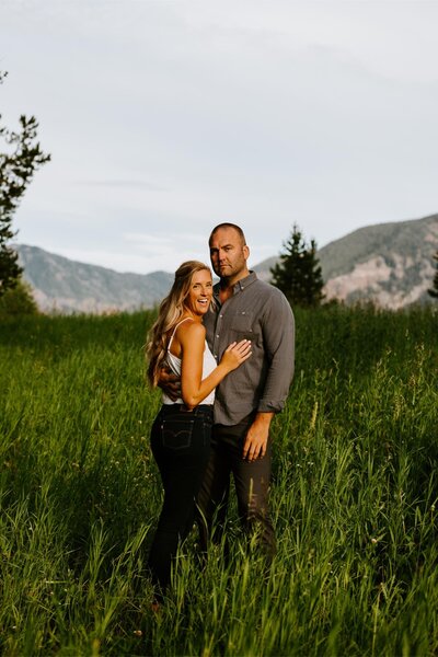 Couple poses in the mountains for their Bozeman engagement photos.