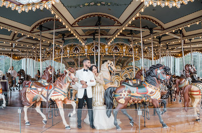 bride & groom standing on carousel
