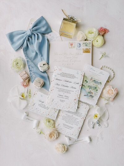  flat lay of wedding invitation details for a French inspired French wedding in San Luis Obispo, California