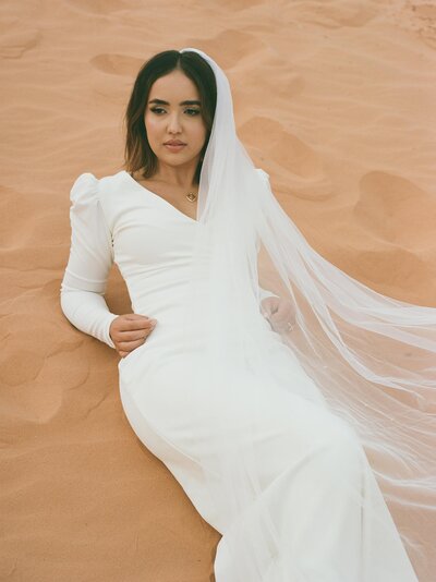 bride in the sand dunes at her snow canyon state park elopement