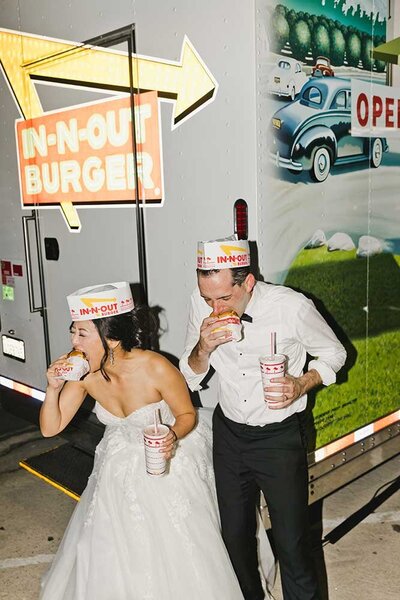 couple eating in-n-out food truck at wedding photo in los angeles