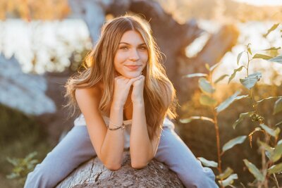 Young woman standing in a tall grassy field in Seattle.