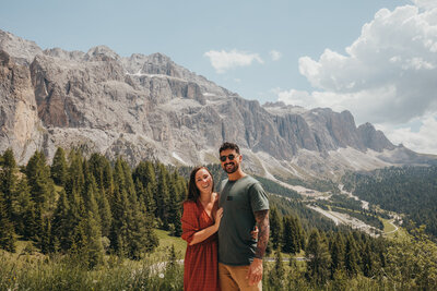 couple pose in front of mountain