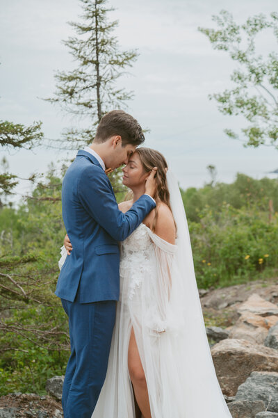 a couple kissing middle of forest