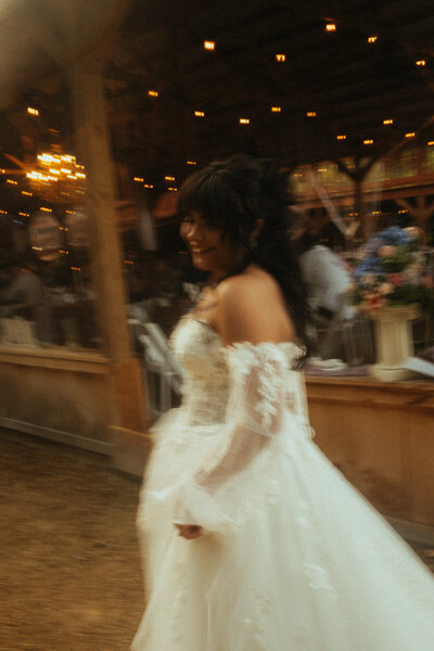 A bride moves on her wedding day, blurred.