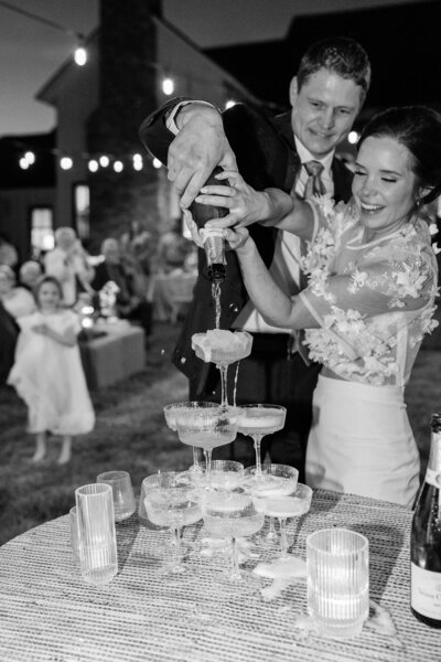 Bride hugging excited bridesmaids after ceremony