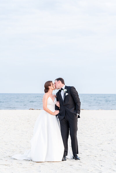 couple by the ocean on cape cod kissing