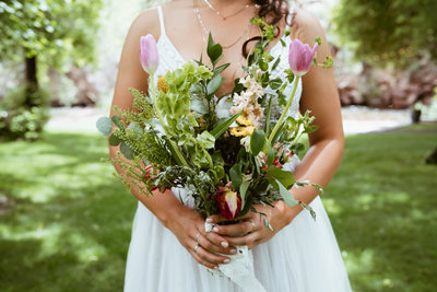 bride holds flowers