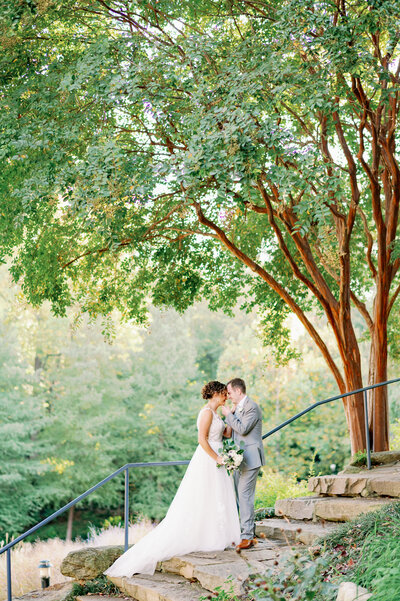 Greenville wedding photographers take wedding portrait in Falls Park