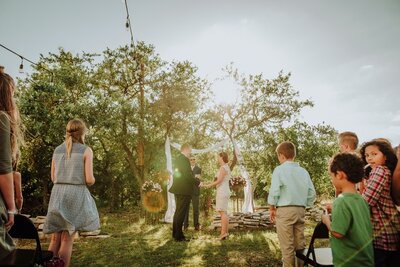 Ceremony-at-backyard-wedding-in-San-Antonio-Texas.-Photos-at-golden-hour.