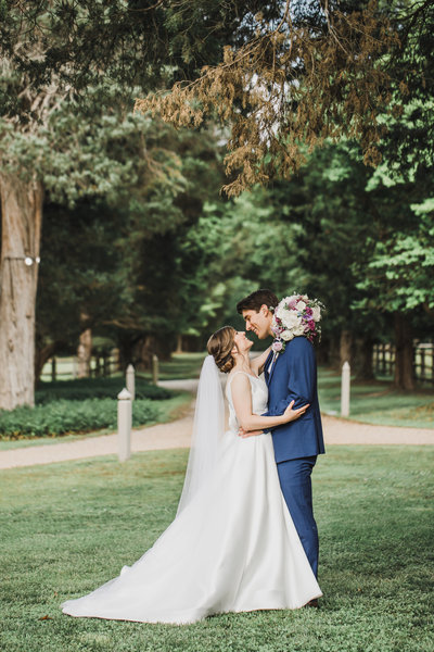 Wedding Photographer & Elopement Photographer, bride and groom kissing under tree