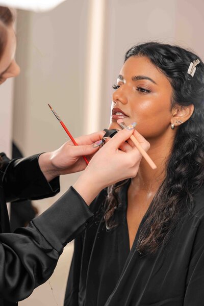 women getting makeup done