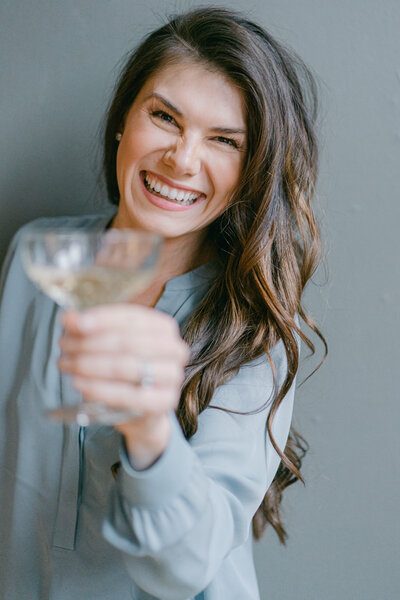 Seattle Washington wedding planner pouring champagne