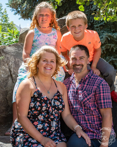 family photo of Mom, Dad and 2 young kids