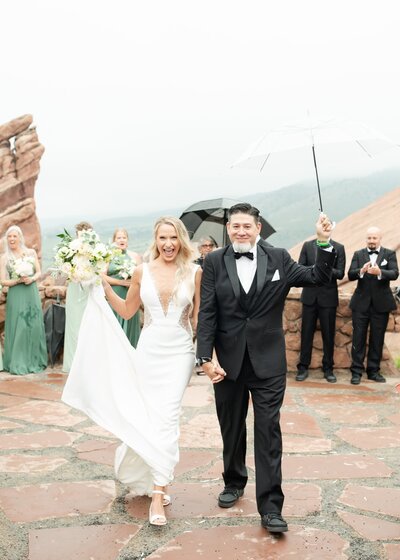Couple walking after getting married at Red Rocks.