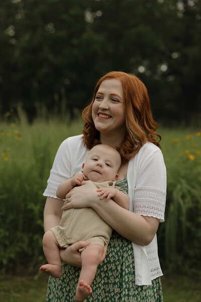 family snuggling newborn