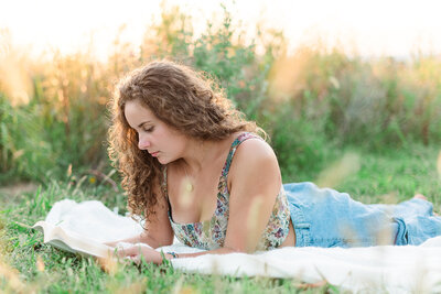 senior girl sitting on a bench showing composition for people who want photographer education or a mentorship by lancaster pa photographer