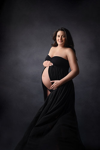 Pregnant mom wearing a black dress