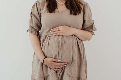 expecting mom holding belly