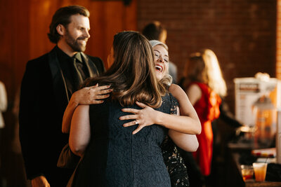 Mother and Daughter hugging at wedding - Alex Bo Photo