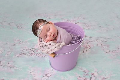 newborn in bucket
