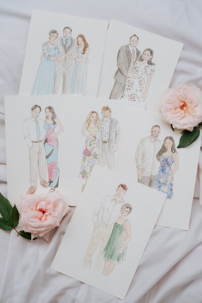 flat-lay-of-live-guest-portraits-custom-wedding-favours