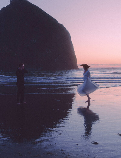 woman twirling while man watches 