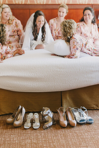 bridesmaids laughing with the bride