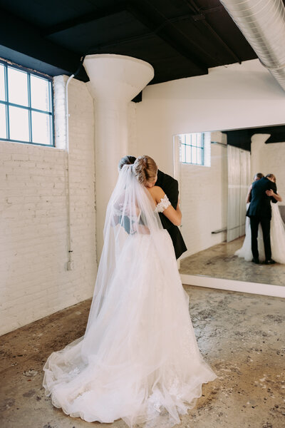 Wedding couple saying I do and having their first kiss after their wedding ceremony