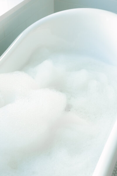 Boutique inn interior with clawfoot bathtub at the Bingham Estate in McKinney, Texas — Southern charm hospitality photography.