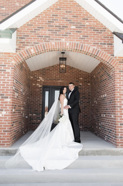 couple posing for wedding photo in winter