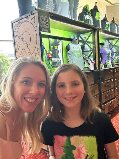 Caroline Weiss spending time with her daughter in nature, representing grounding, joy, and emotional balance.