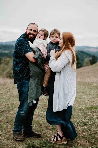 family standing at fitton green natural area  in corvallis oregon