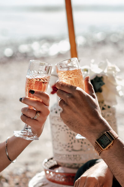 Close-up of champagne glasses clinking during Harleen and Jayse’s Auckland proposal photoshoot, captured by Zanthe Vorsatz.