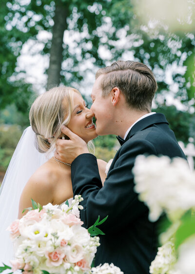 bride and groom kissing on wedding day