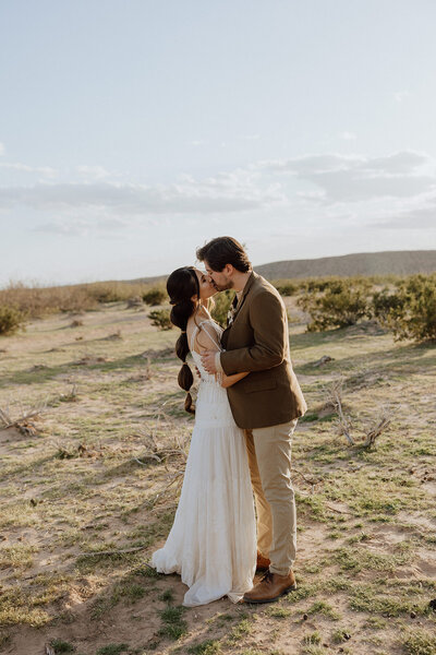 bride riding a horse with the sun shining in the background