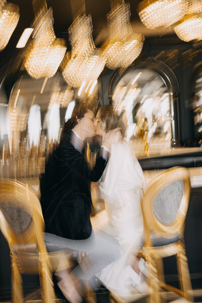 groom and bride sit at the bar at the willows at ashcombe in harrisburg. image by philadelphia wedding photographer emily wilkerson