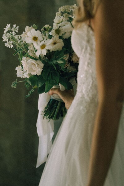 bride and groom interlocking arms