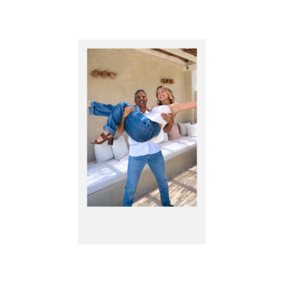 A father picking up his daughter happily symbolizing a healthy fun family dynamic.