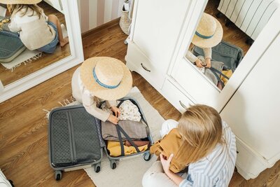 overhead shot of packing a suitcase