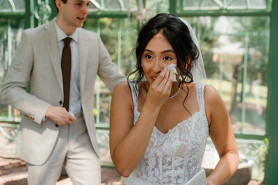 A bride wiping away a tear