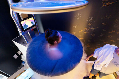 woman in cryotherapy full body chamber treatment