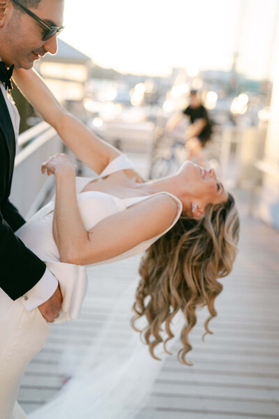 Bride and groom portraits at sunset on the docks at Pier 59 in NYC