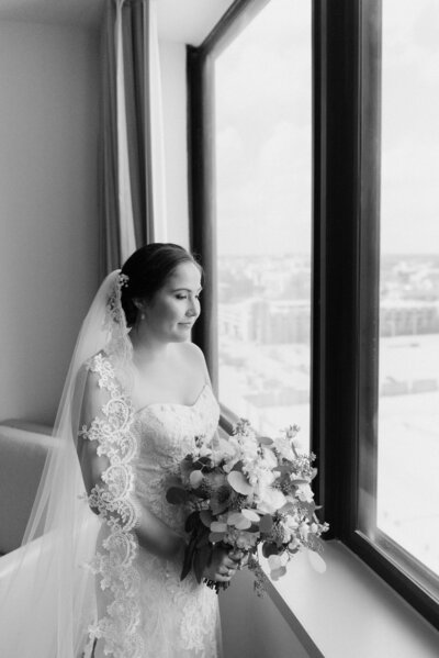 Bride looks from her hotel Omni Severin Indianapolis