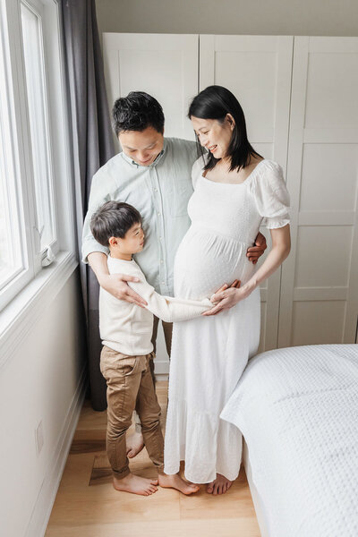 Family preparing for the arrival of their new sibling during their toronto maternity portrait session