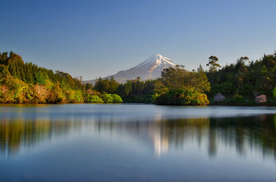 A mount Taranaki surrounded by water