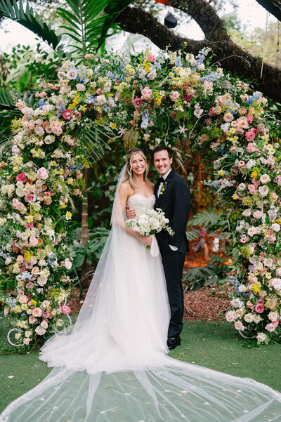 brideandgroomsmilingatthecamera