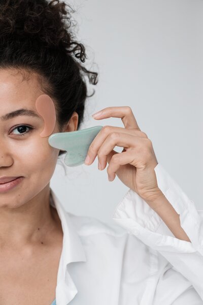 A women putting pads on her face