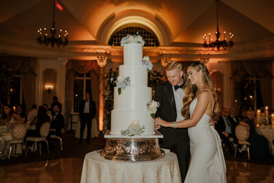 bride and groom cutting their giant wedding cake at the pleasantdale chateau in new jersey