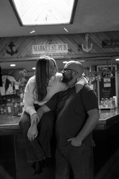 Engaged couple hanging out at local Warren RI bar, Market St. Pub.